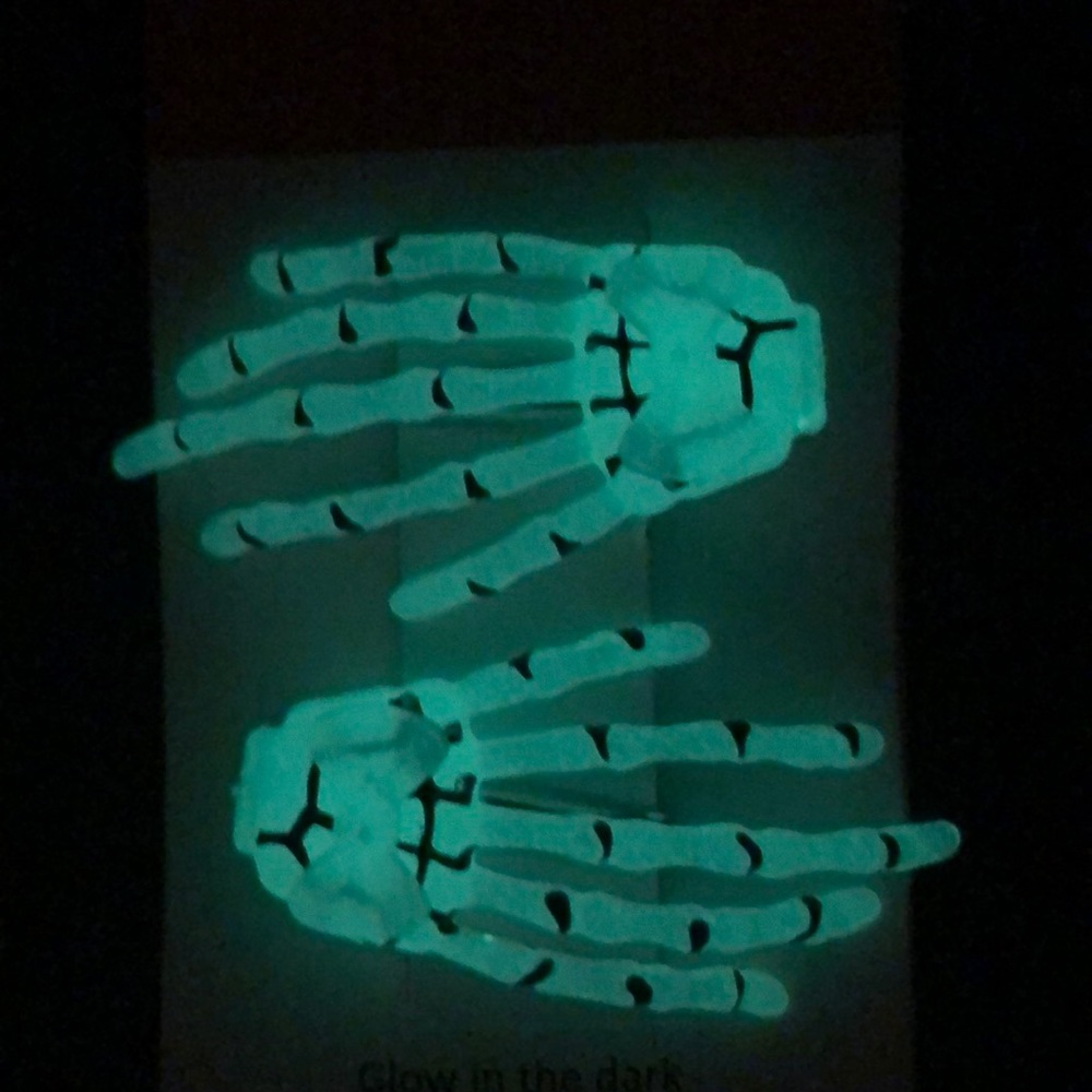 Glow in the dark skeleton hand barrettes.